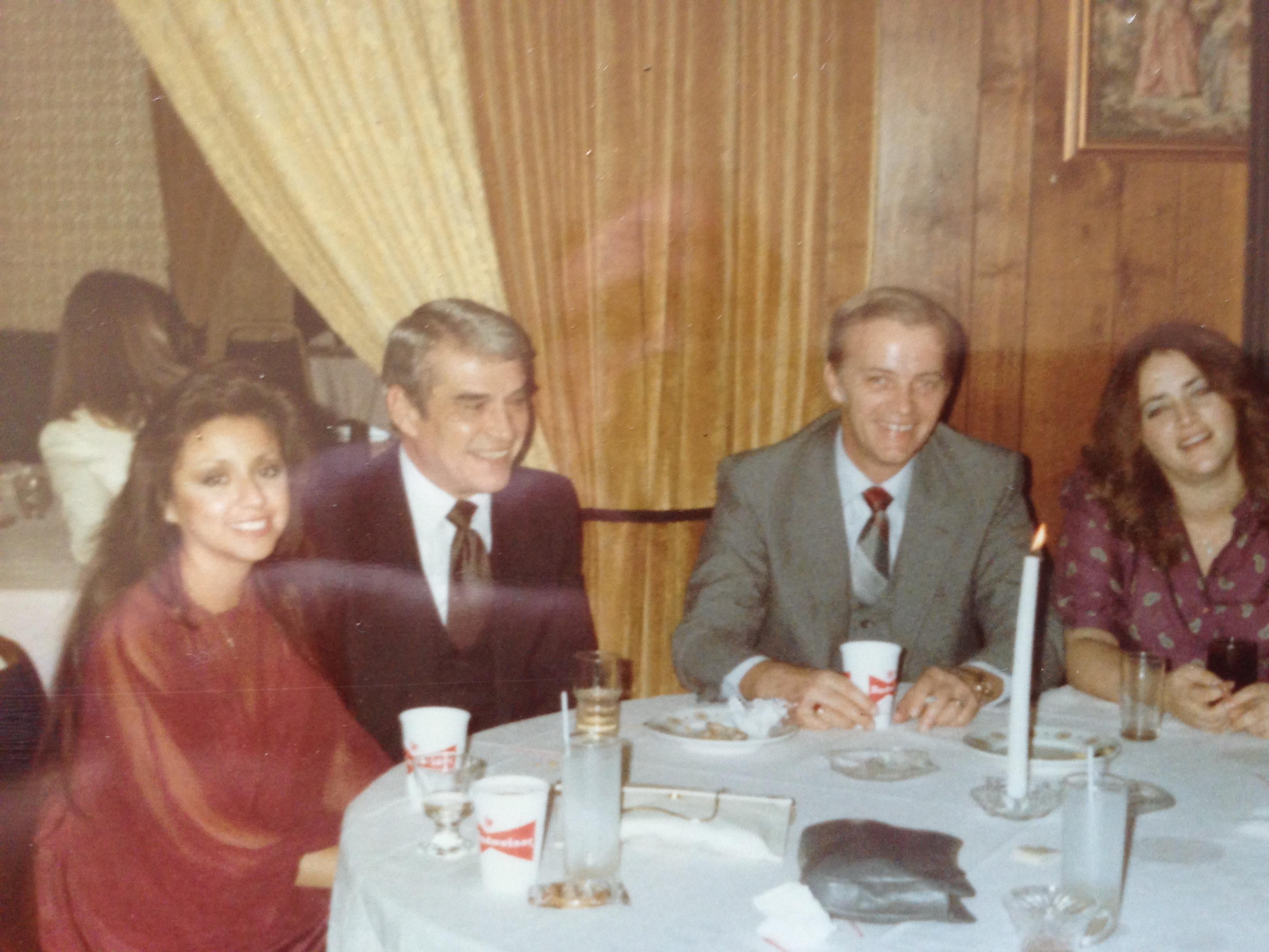 A group of people sitting at a table