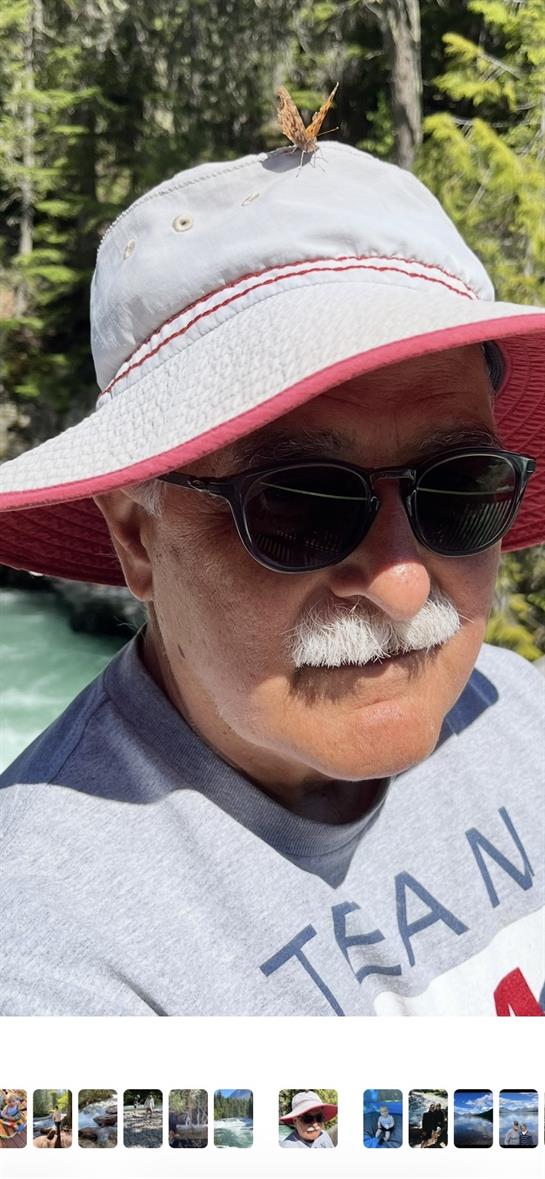A man wearing a hat and sunglasses