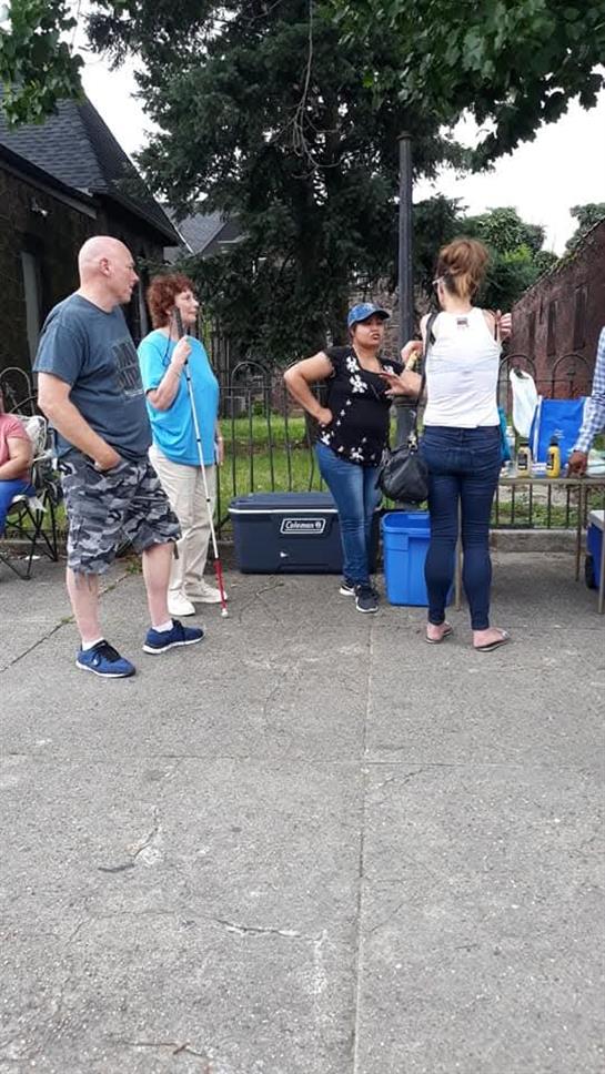 A group of people standing outside
