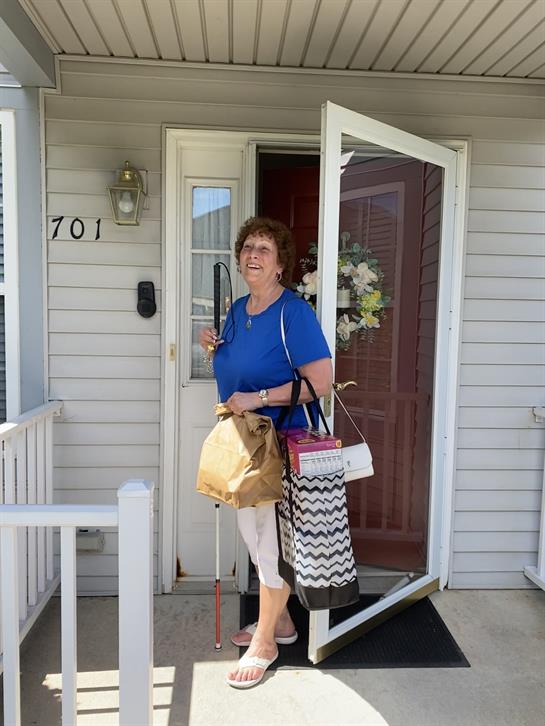A woman standing in front of a door