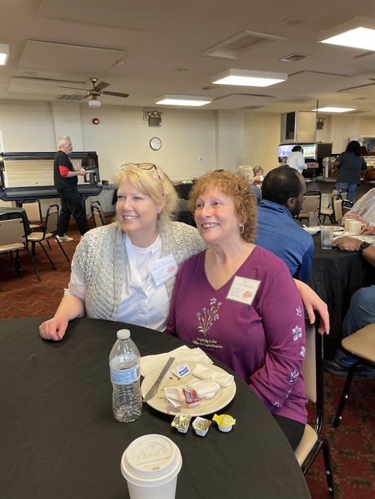 Two women sitting at a table