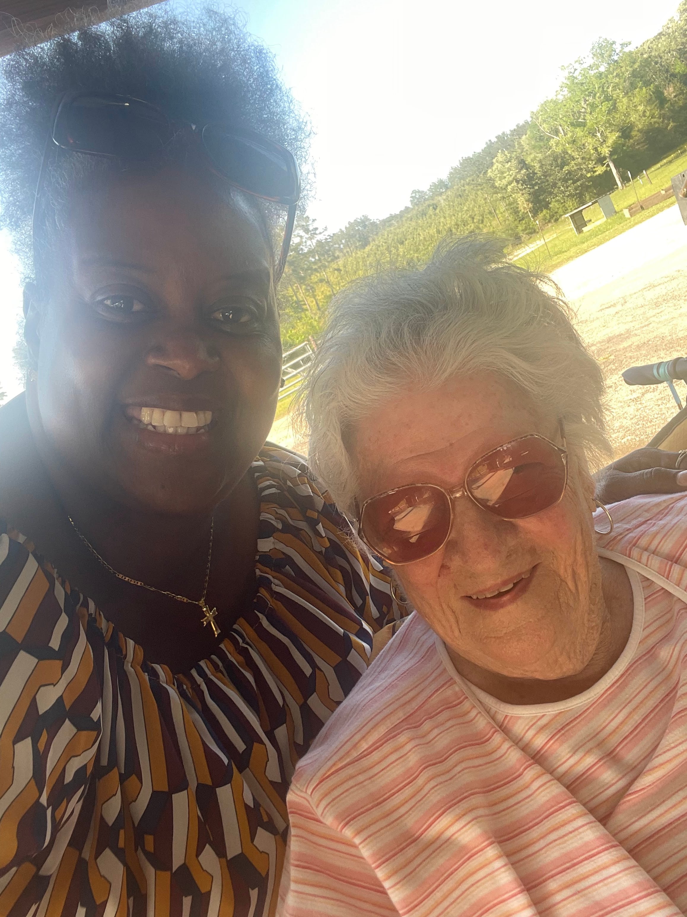 A woman and a woman taking a selfie