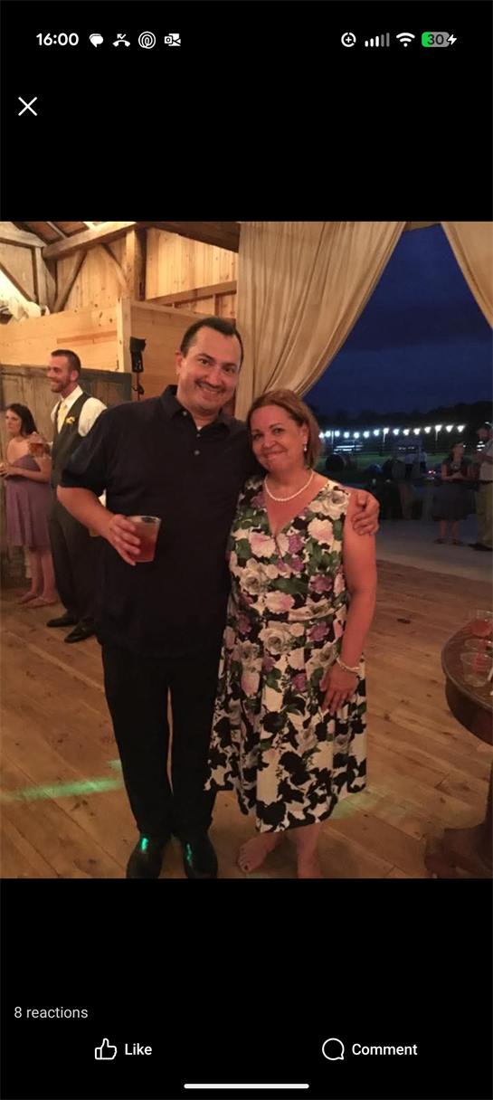 A man and woman posing for a picture