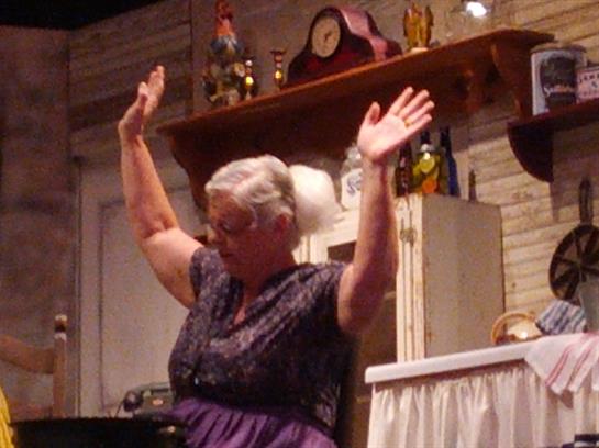A woman with her hands up