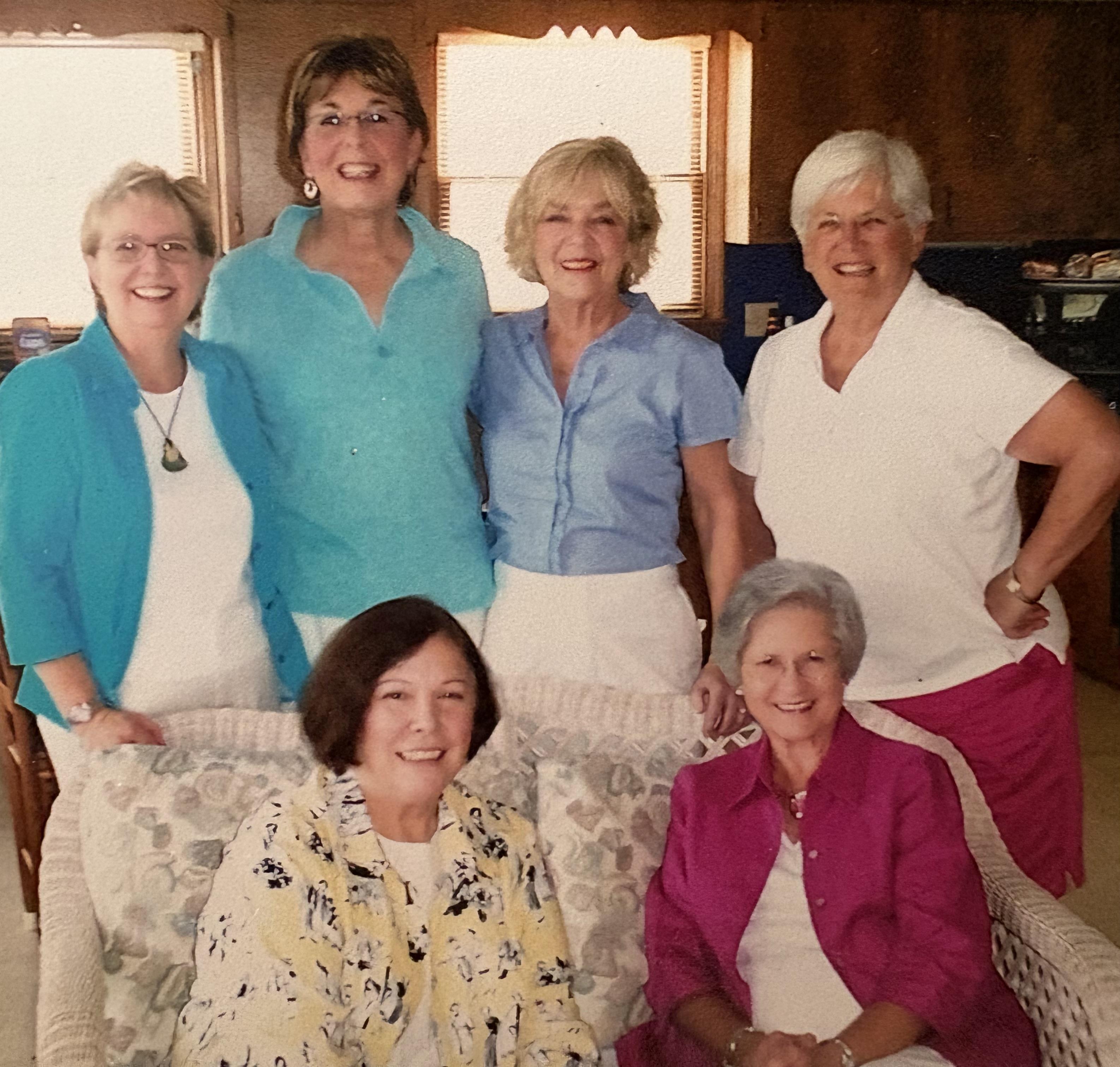 A group of women posing for a photo
