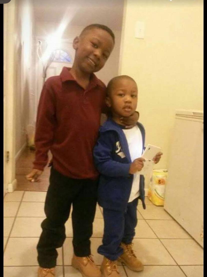 A couple of boys standing together