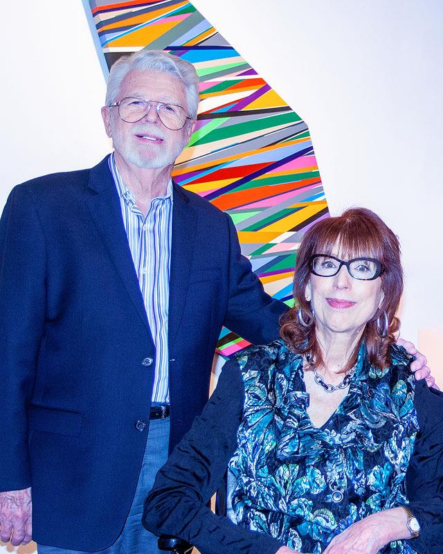 A man and woman posing for a picture