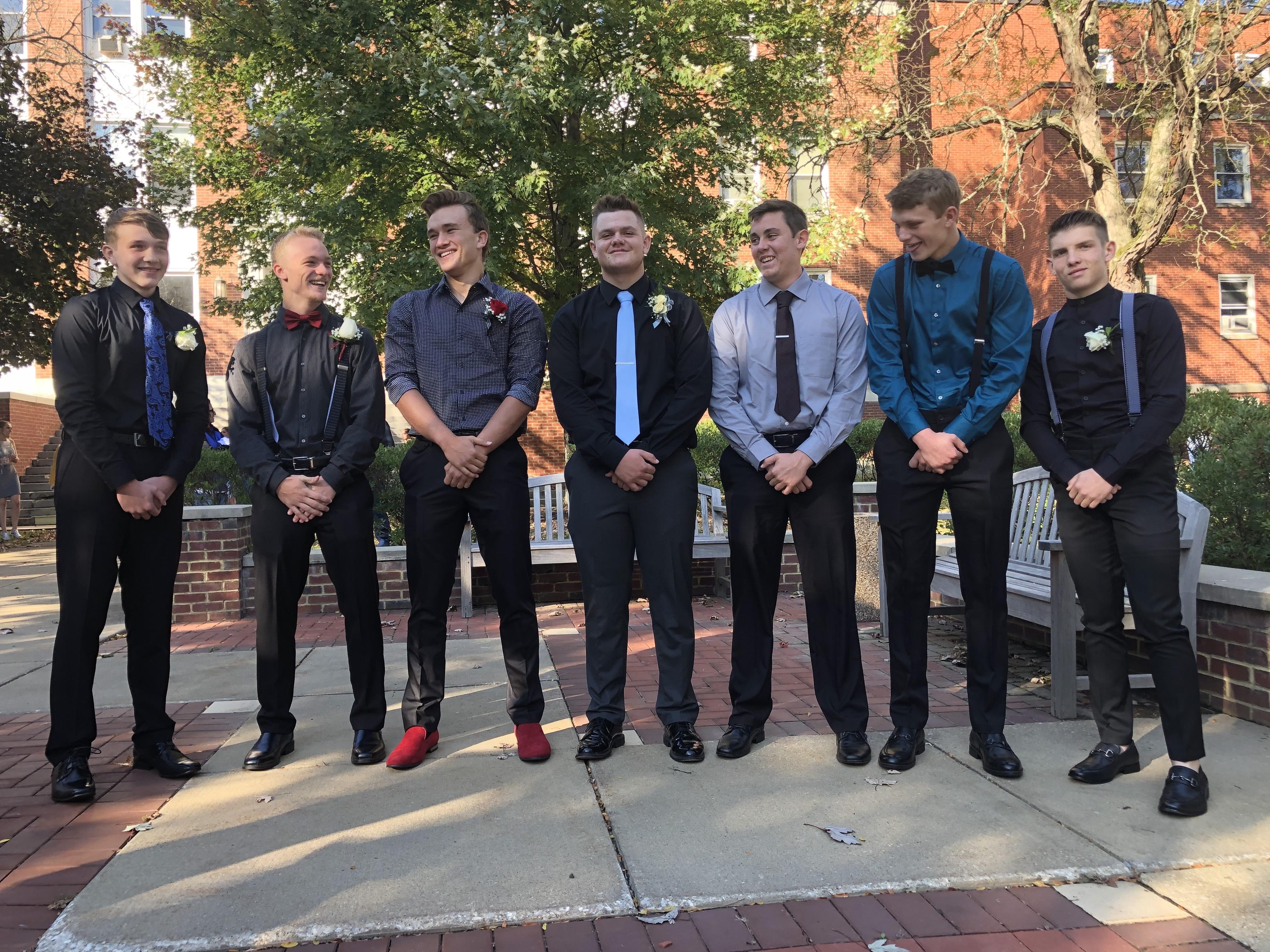 A group of men in suits