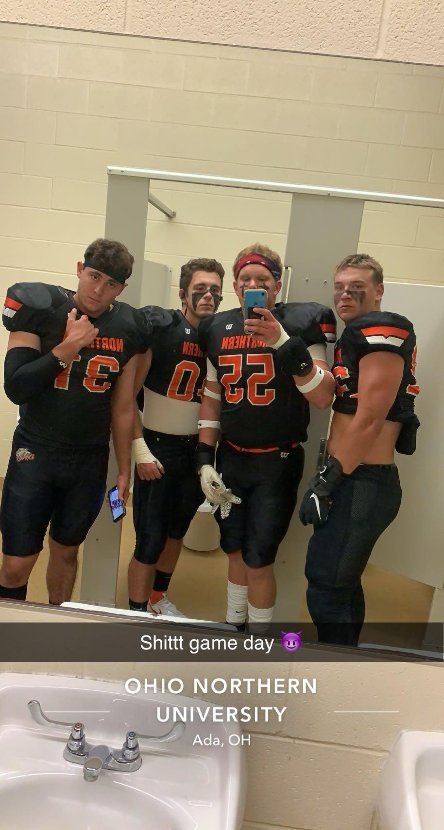 A group of men in football uniforms