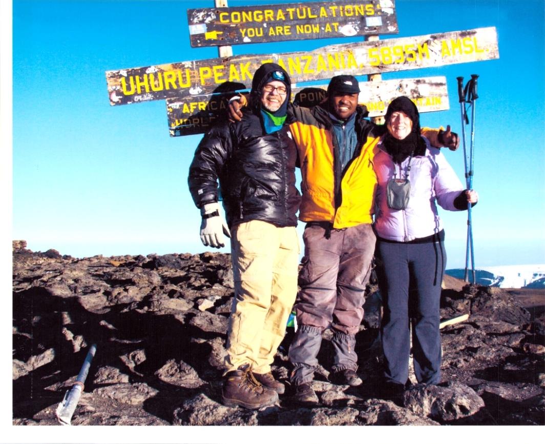 A group of people standing on a mountain
