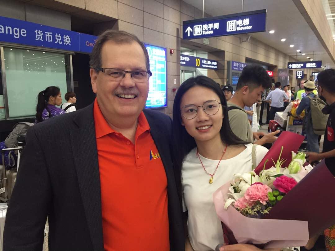 A man and woman posing for a picture