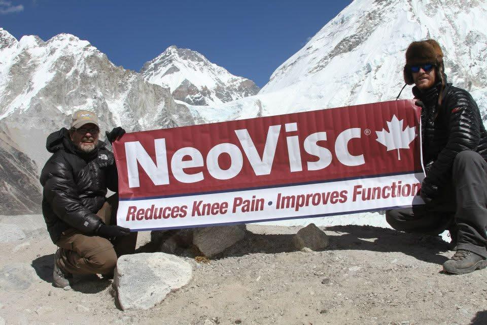 A group of people holding a banner