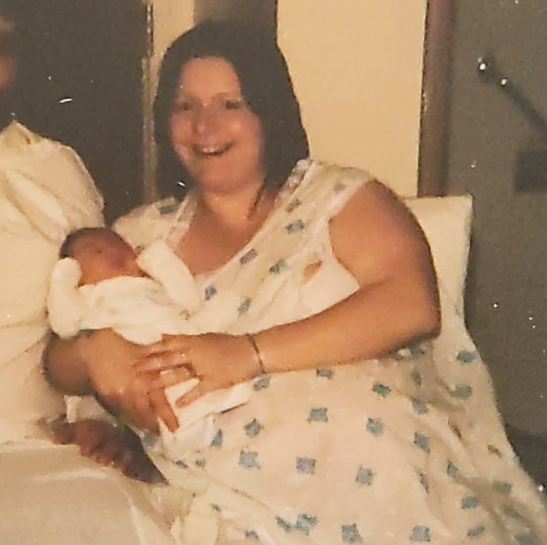 A woman holding a baby