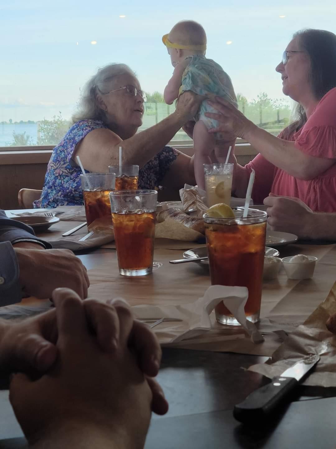 A group of people at a table with drinks