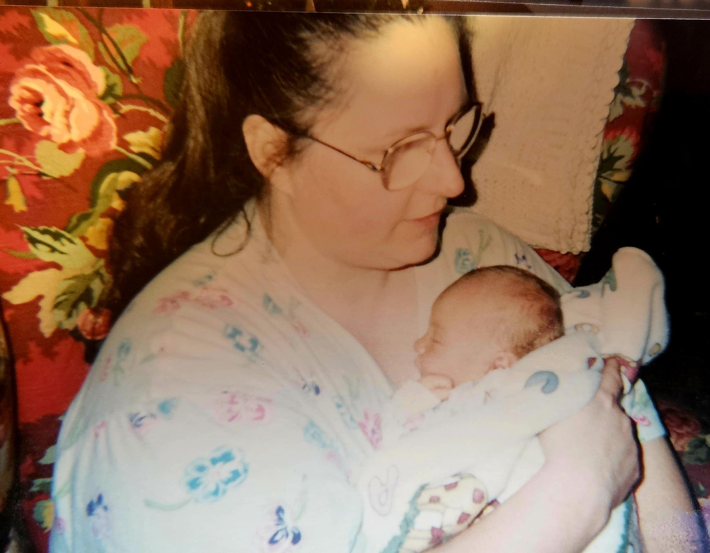 A woman holding a baby