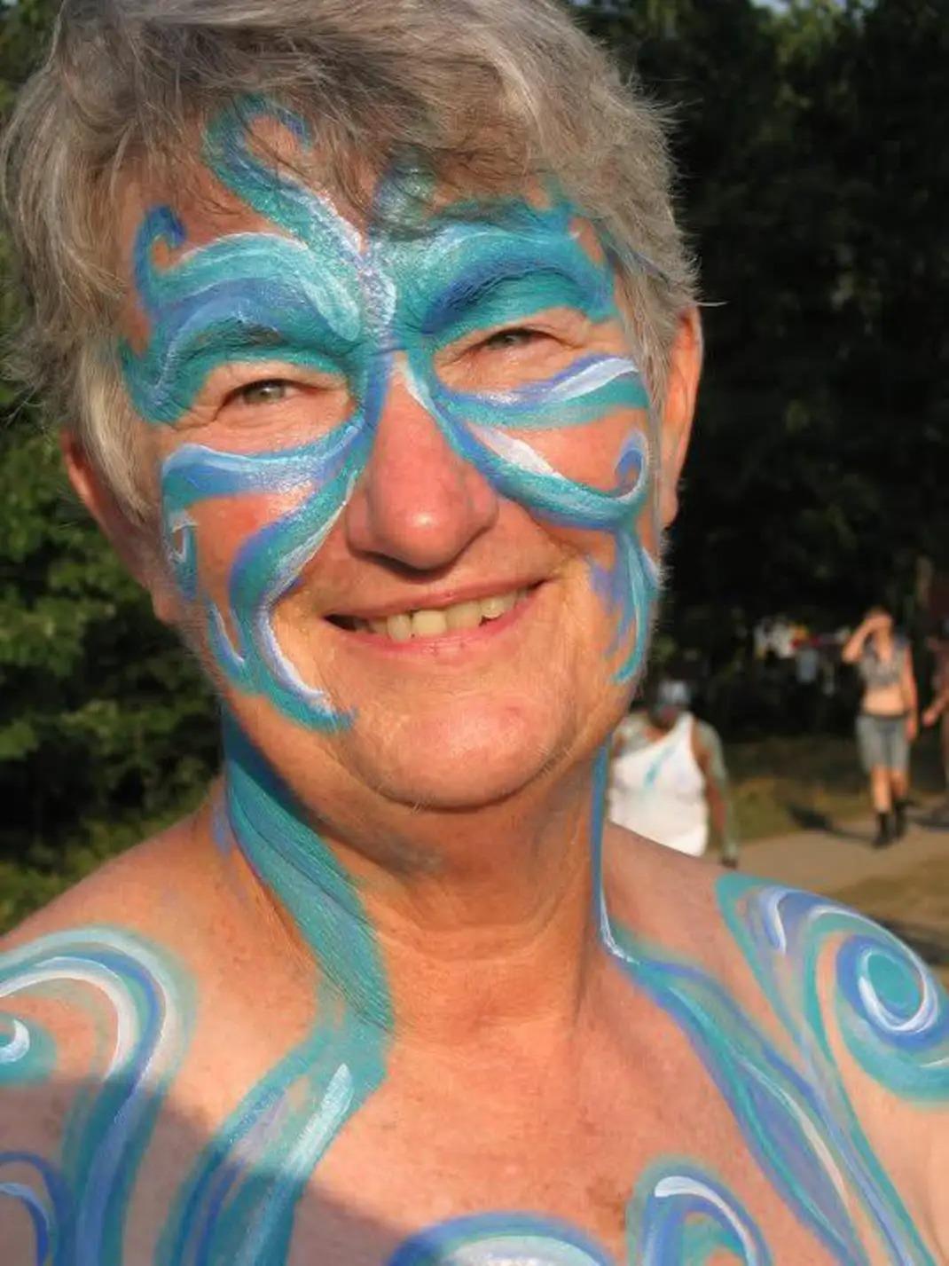 A woman with blue face paint