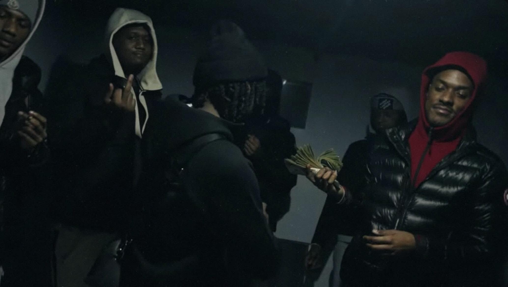 A group of men in hoods