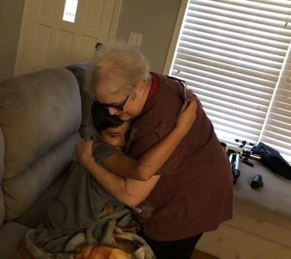 A woman hugging a child