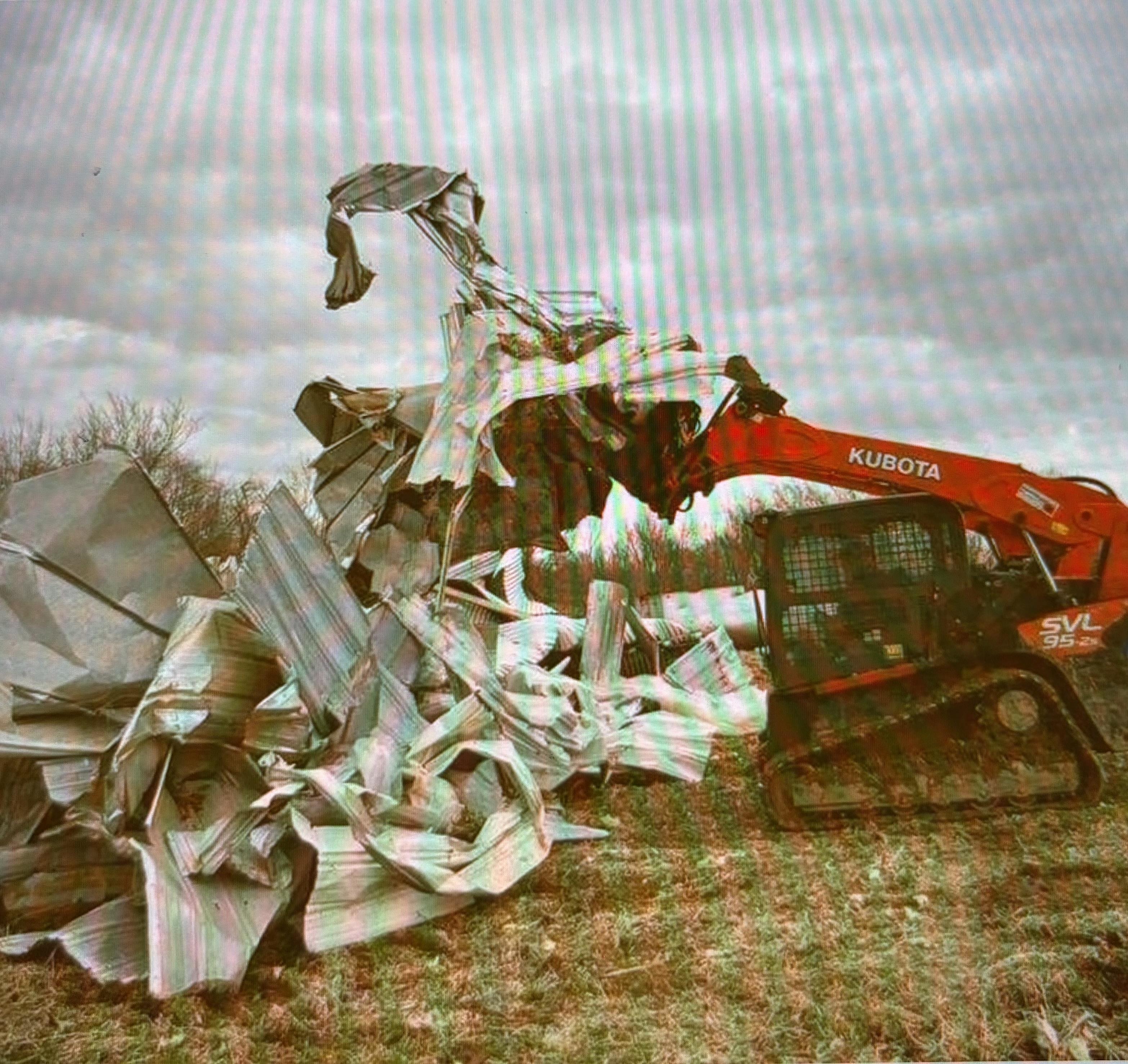 A bulldozer with a pile of debris