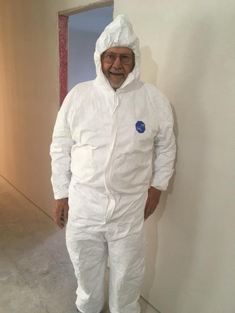 A man in a white suit