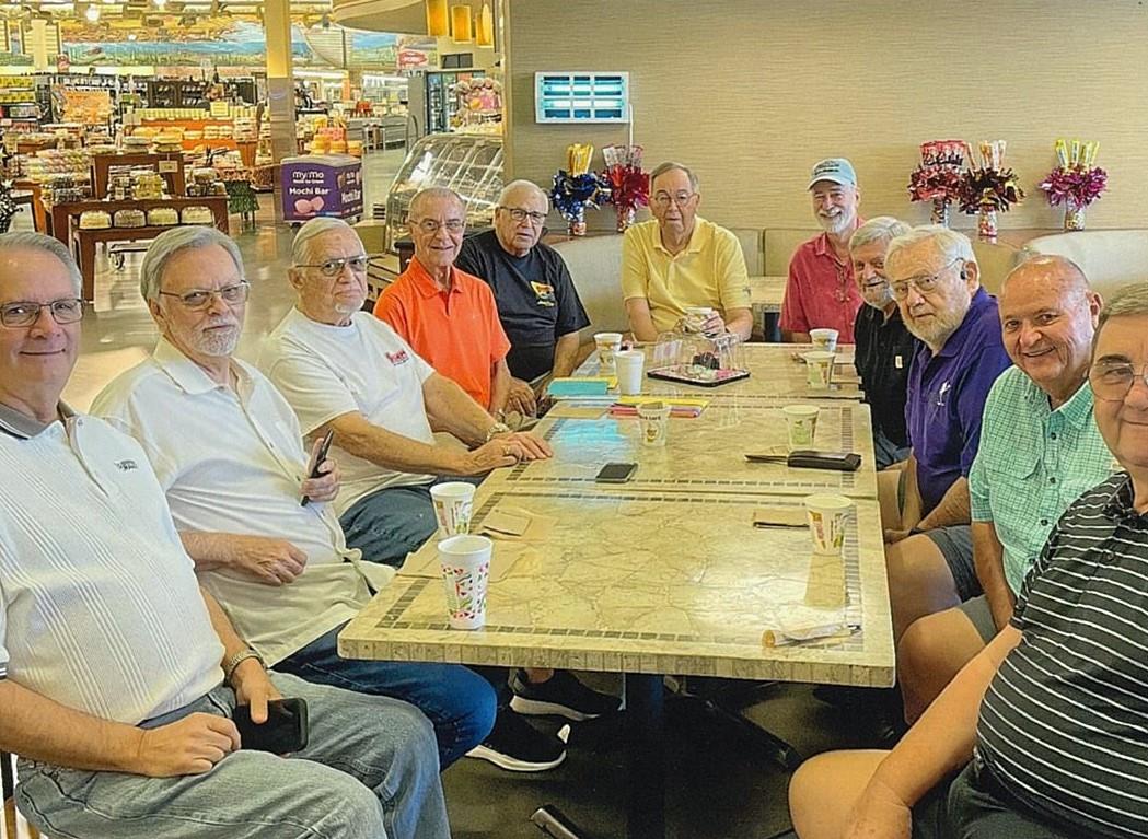 A group of people sitting around a table