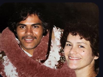 A man and woman smiling