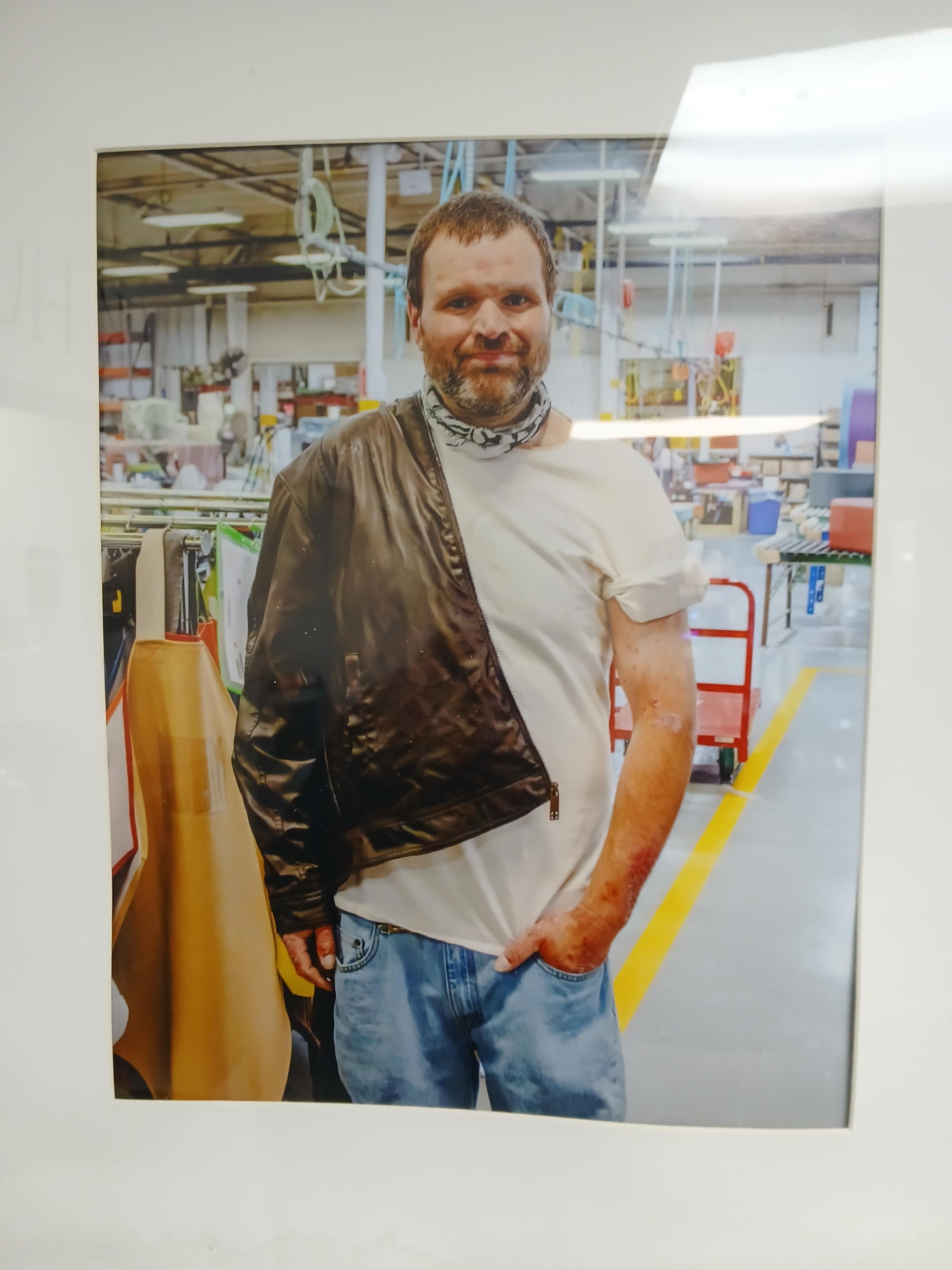 A man in a white shirt and a black jacket