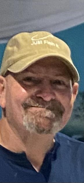 A man with a beard and mustache wearing a hat