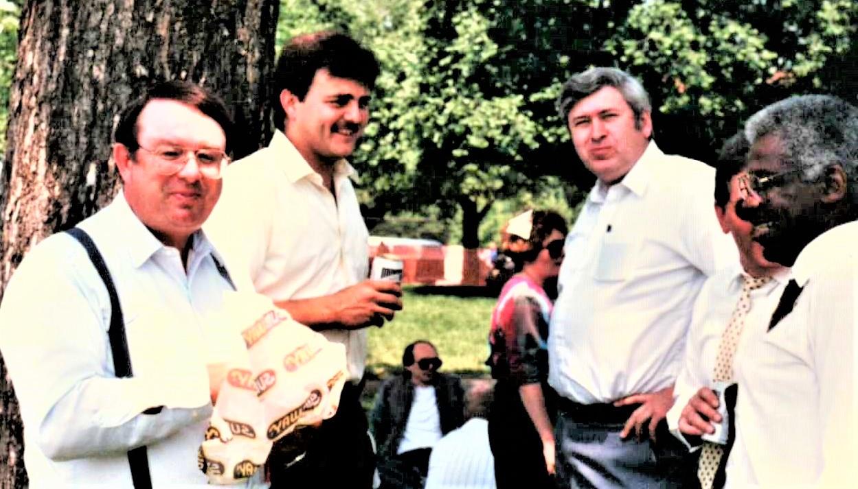 A group of men standing outside