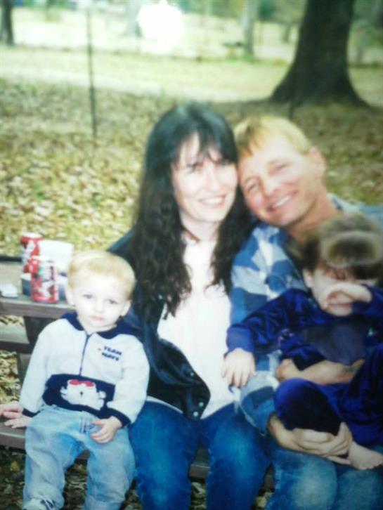 A man and woman with two children