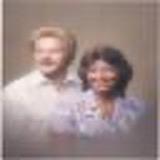 A blurry image of a man and woman