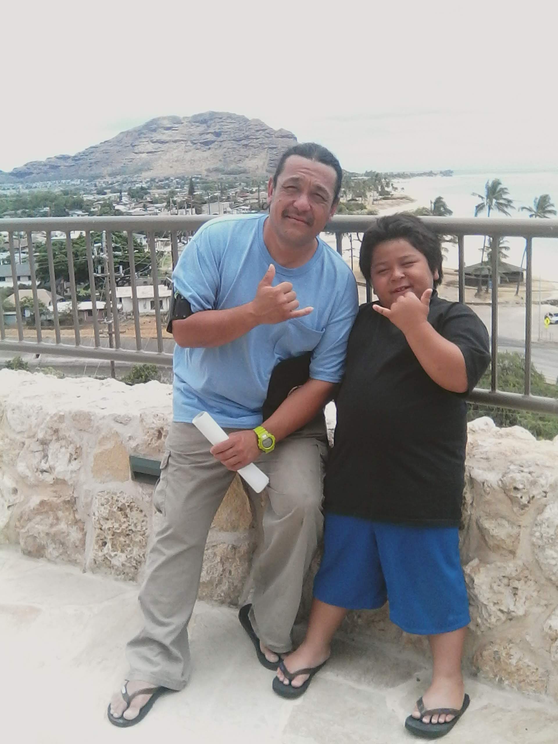A man and boy posing for a picture