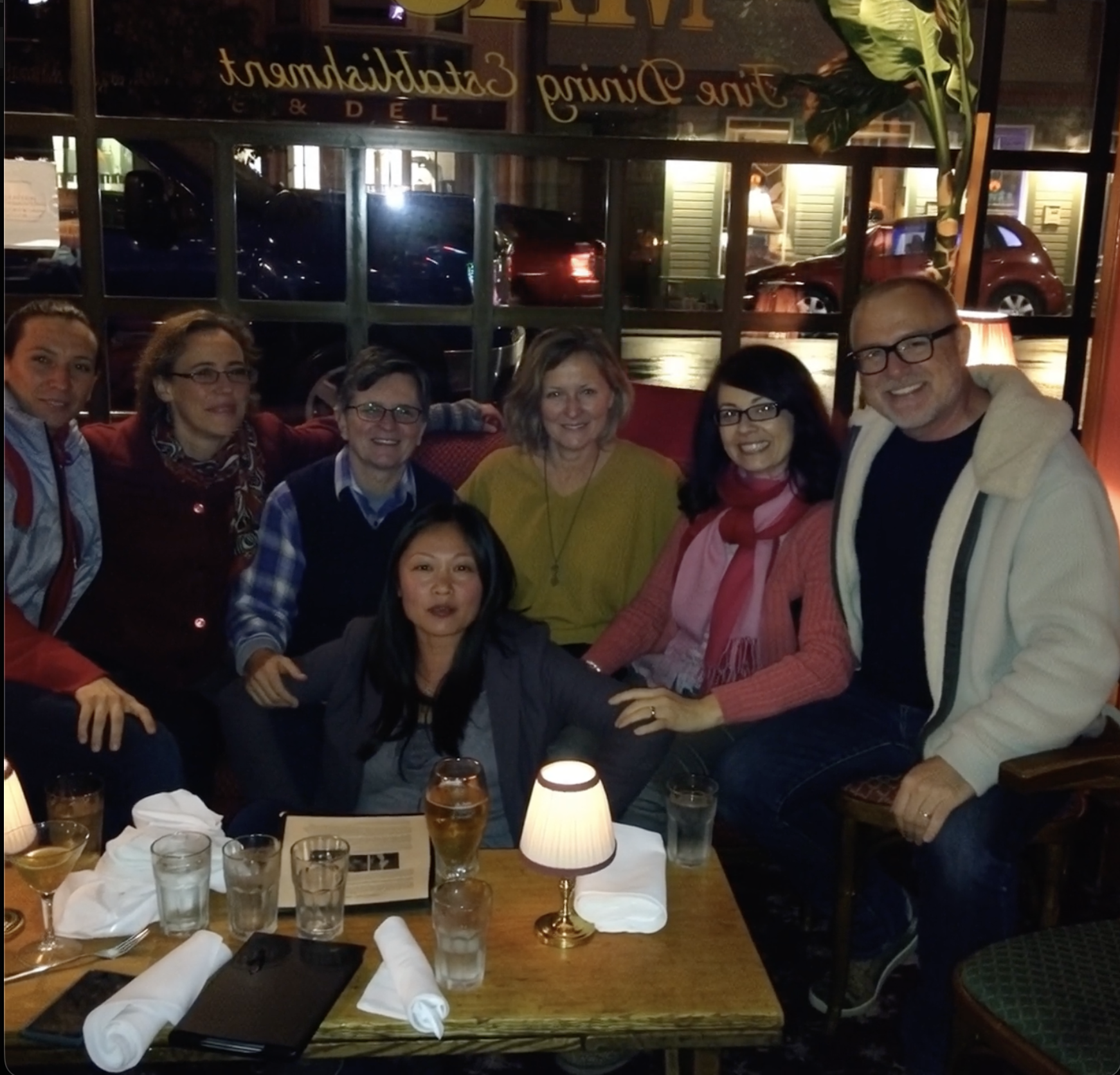 A group of people sitting at a table