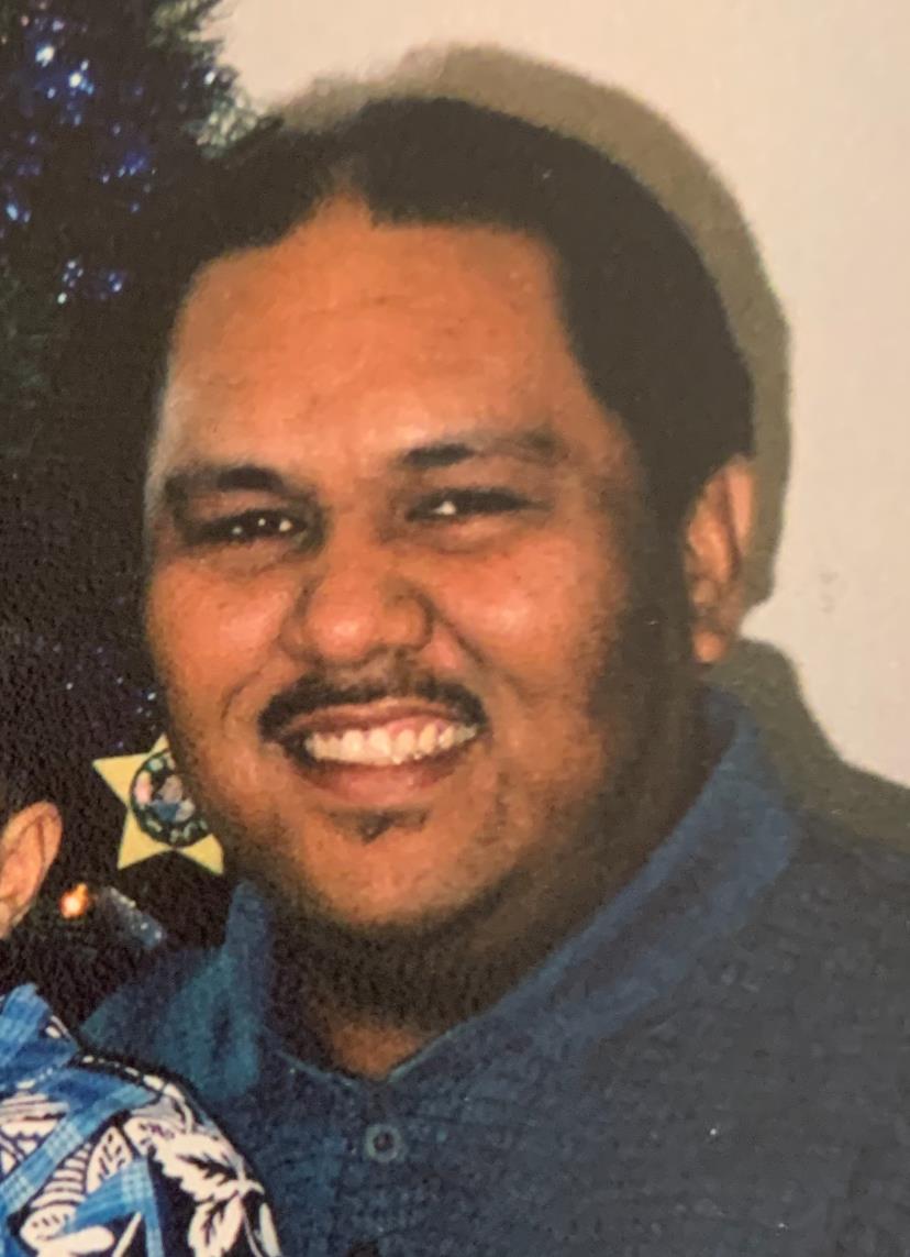 People enjoy a fun time together while smiling and posing for a picture at a gathering.