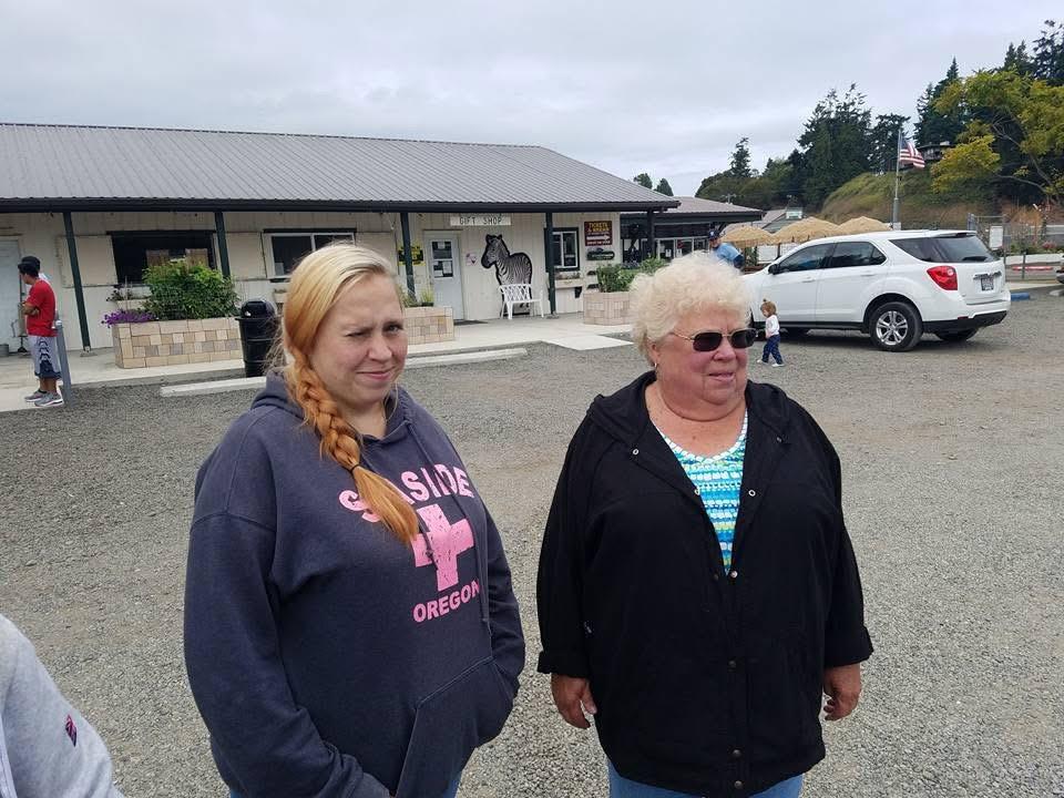 Two women are outside a restaurant in Oregon.