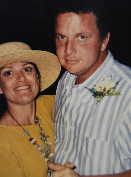 A man and woman posing for a picture