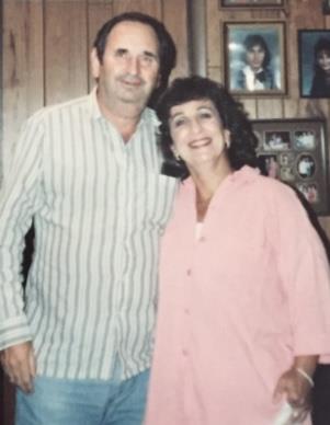 A man and woman posing for a picture