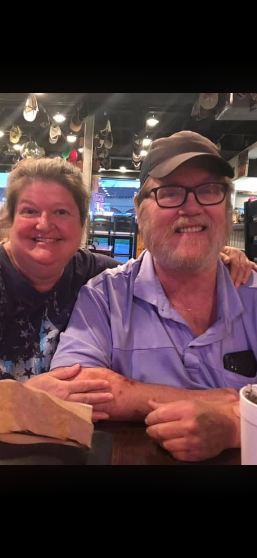 A man and woman smiling at camera