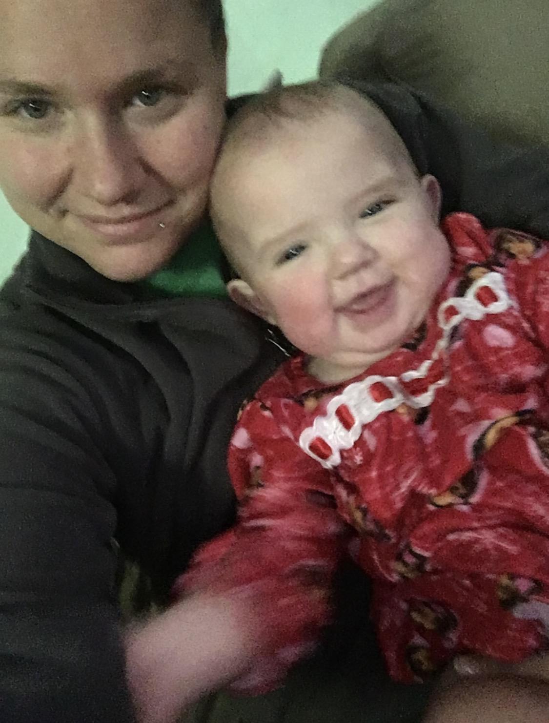 A woman holding a baby