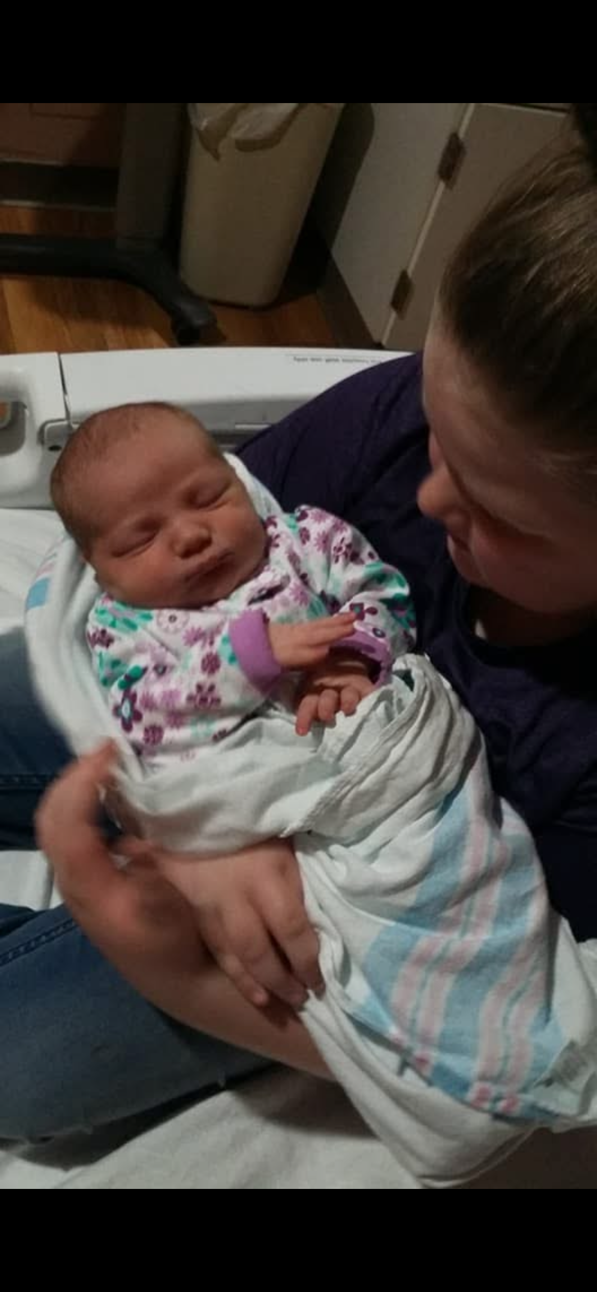 A woman holding a baby