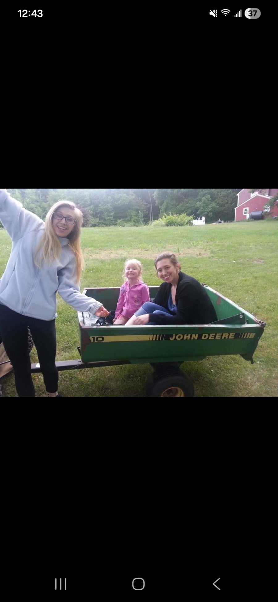A group of women and a child in a trailer