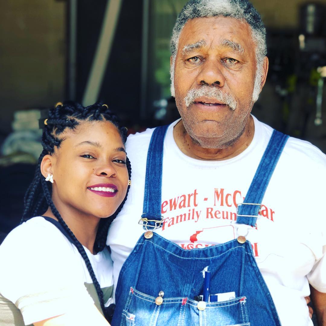 A man and woman posing for a picture