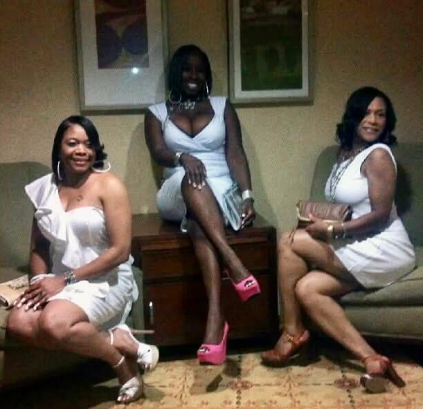 A group of women sitting on a couch