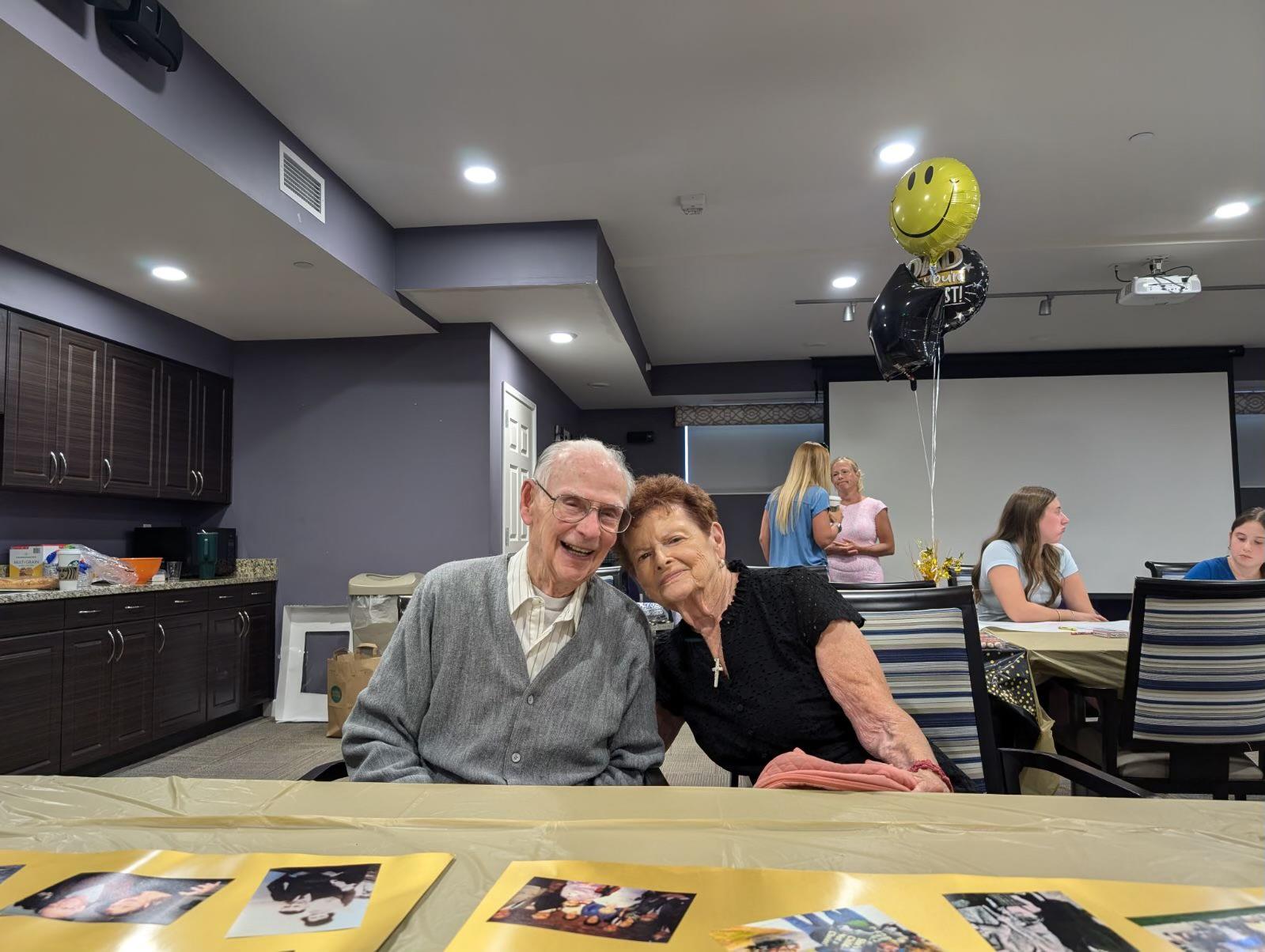 A man and woman sitting at a table