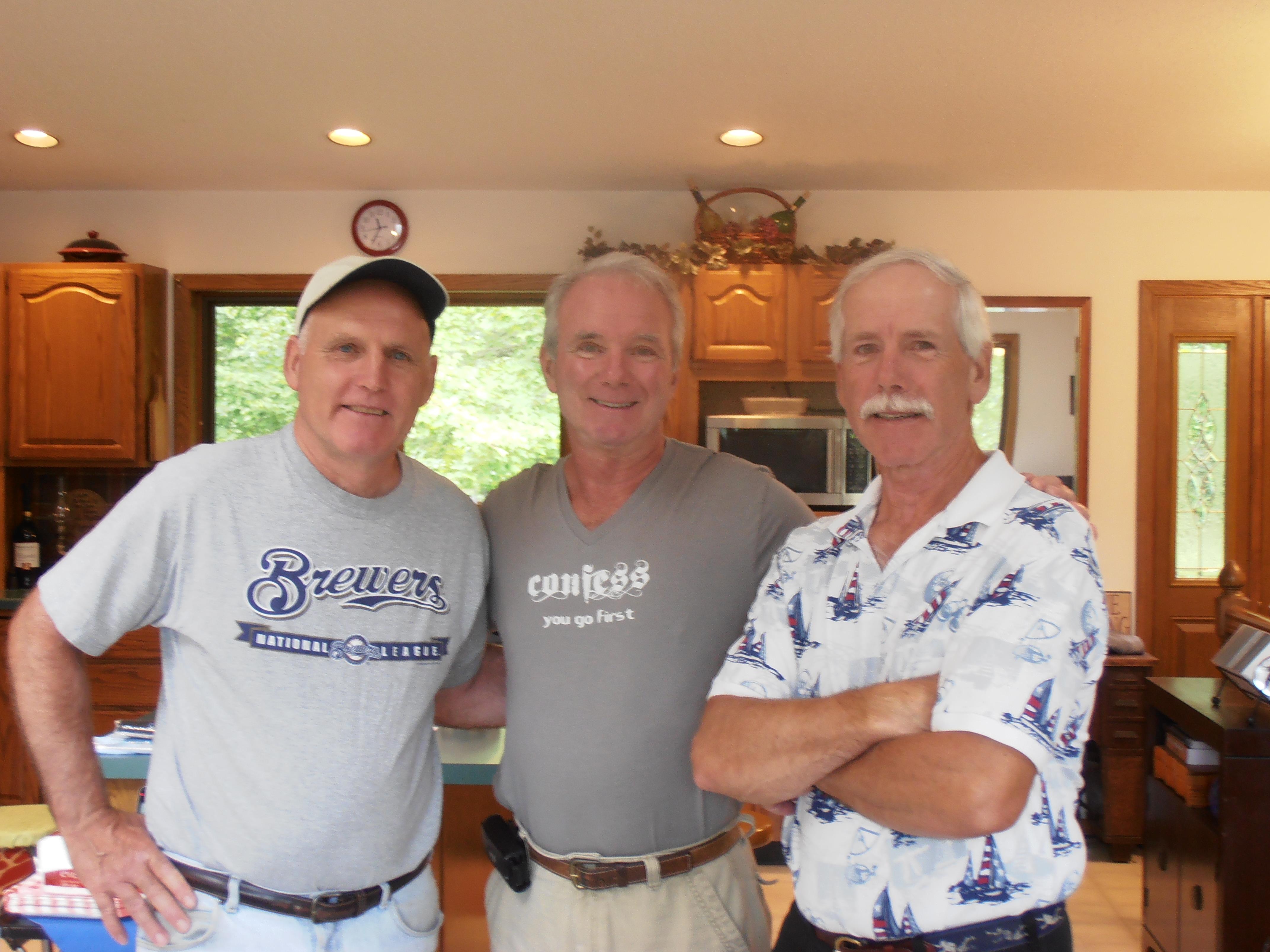 A group of men posing for a photo