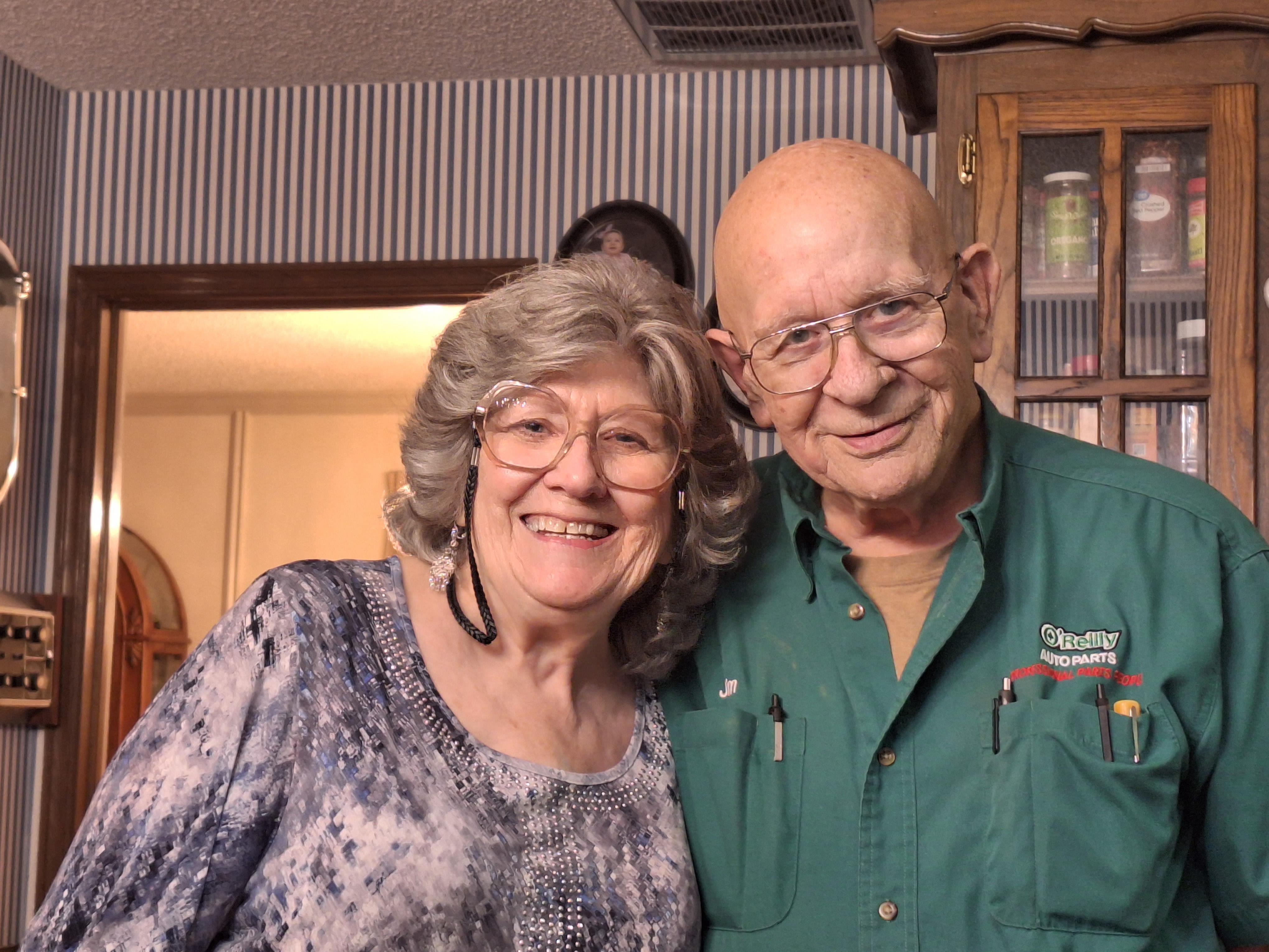 A man and woman smiling