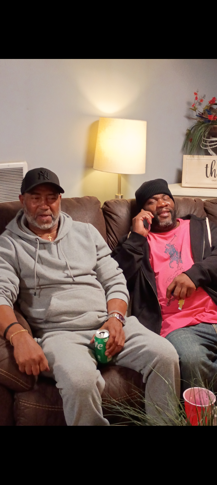 Two men sitting on a couch