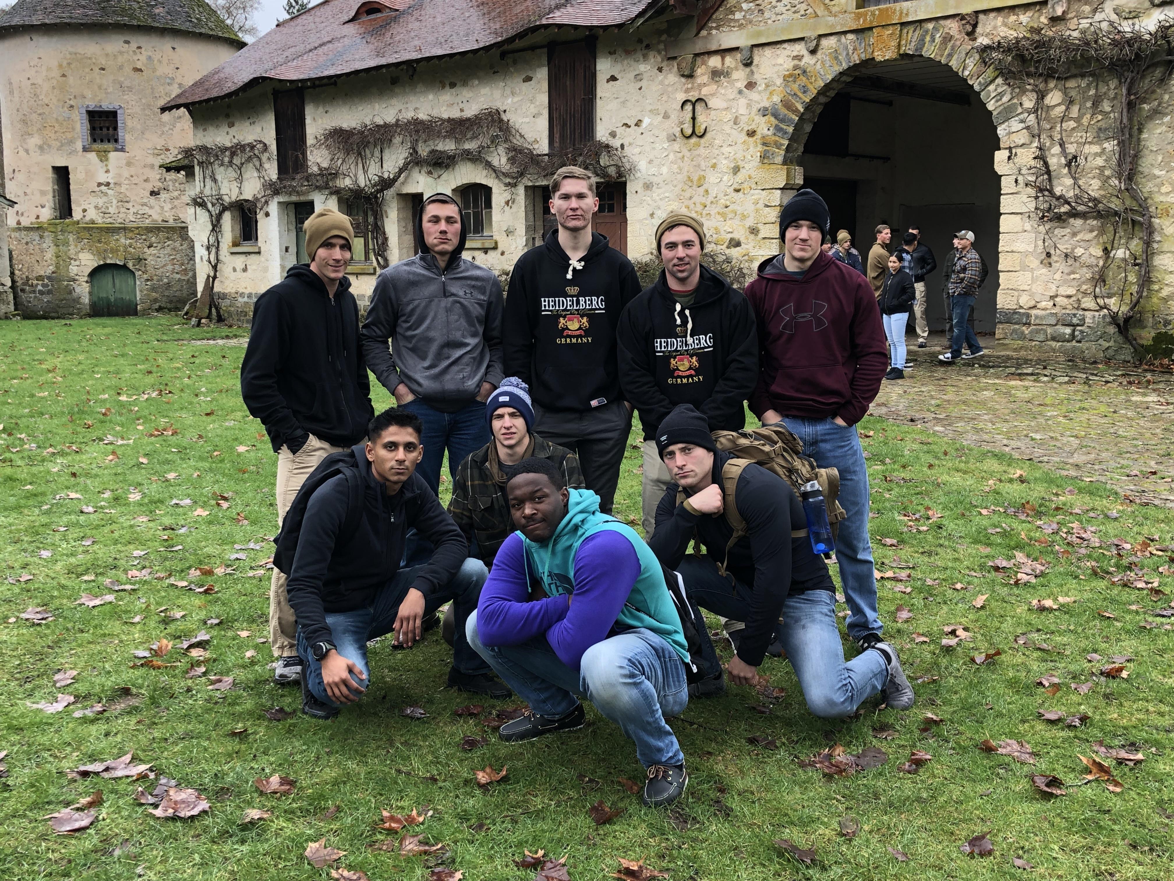 A group of men posing for a photo