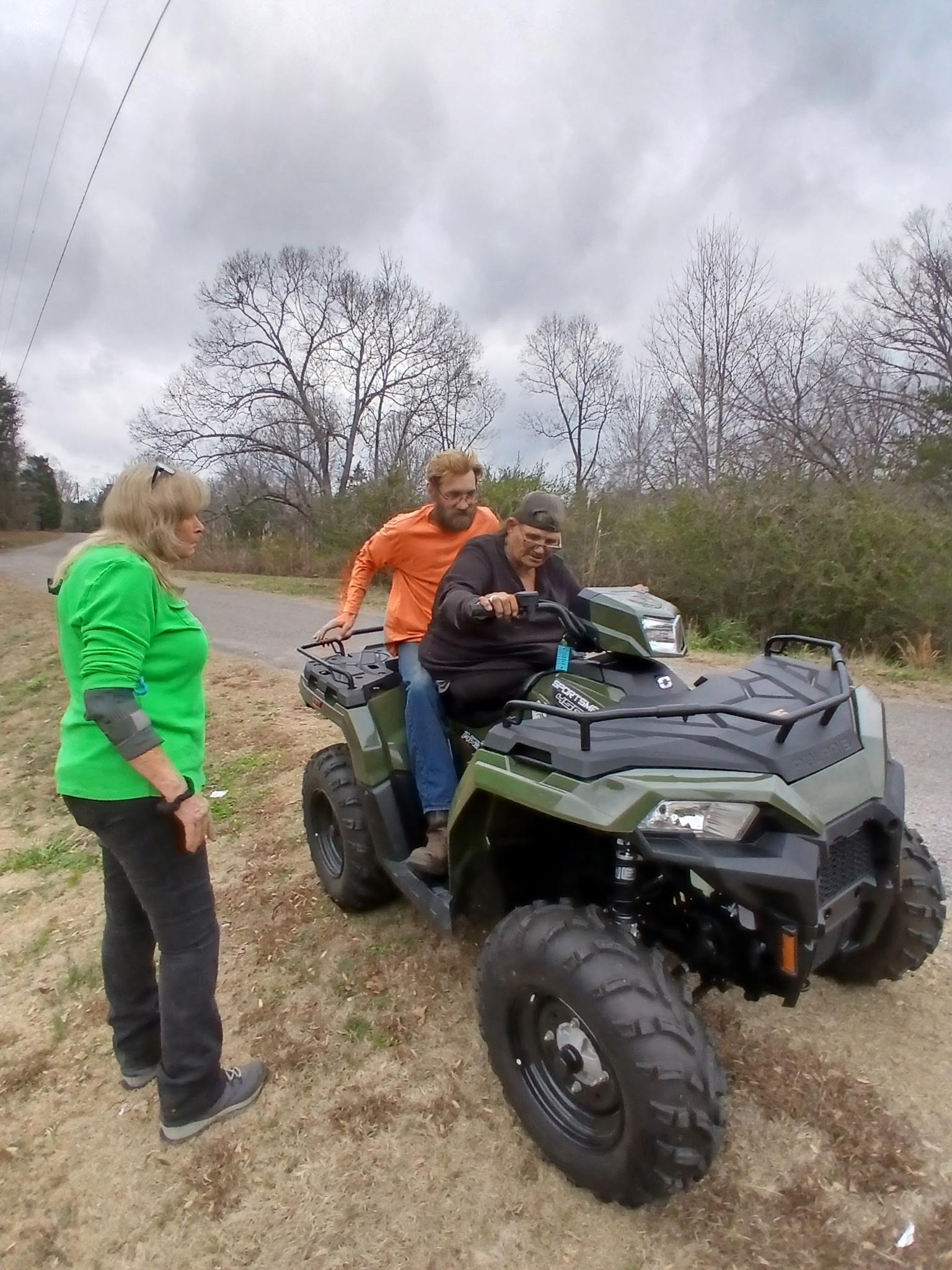A group of people on a four wheeler