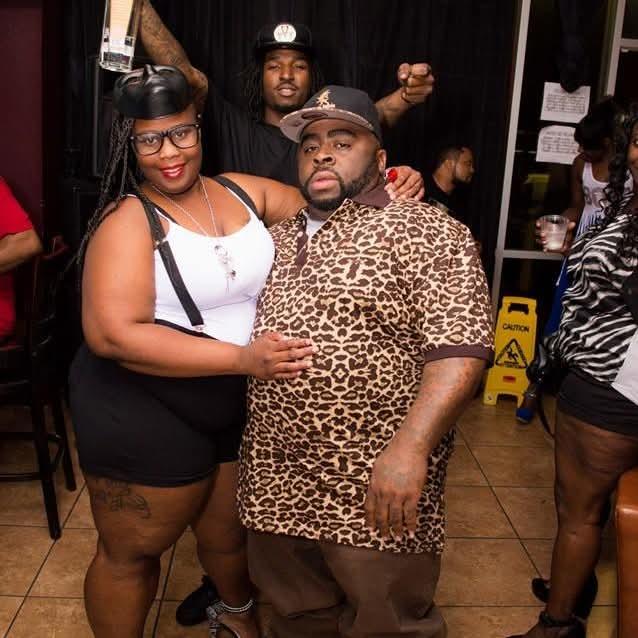 A man and woman posing for a picture